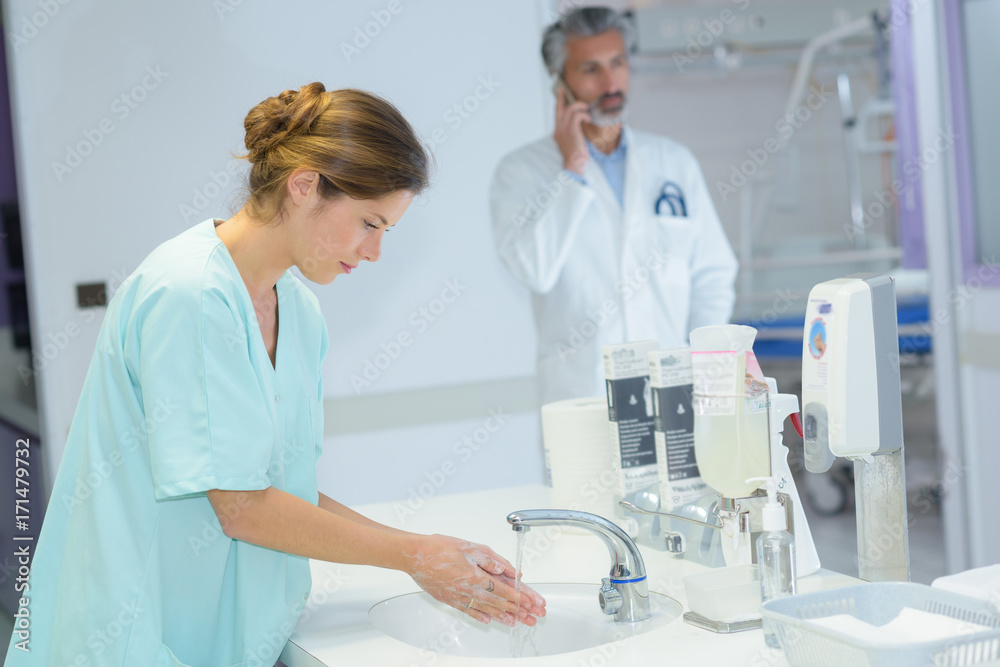 young beautiful nurse washes hands young beautiful nurse washes hands