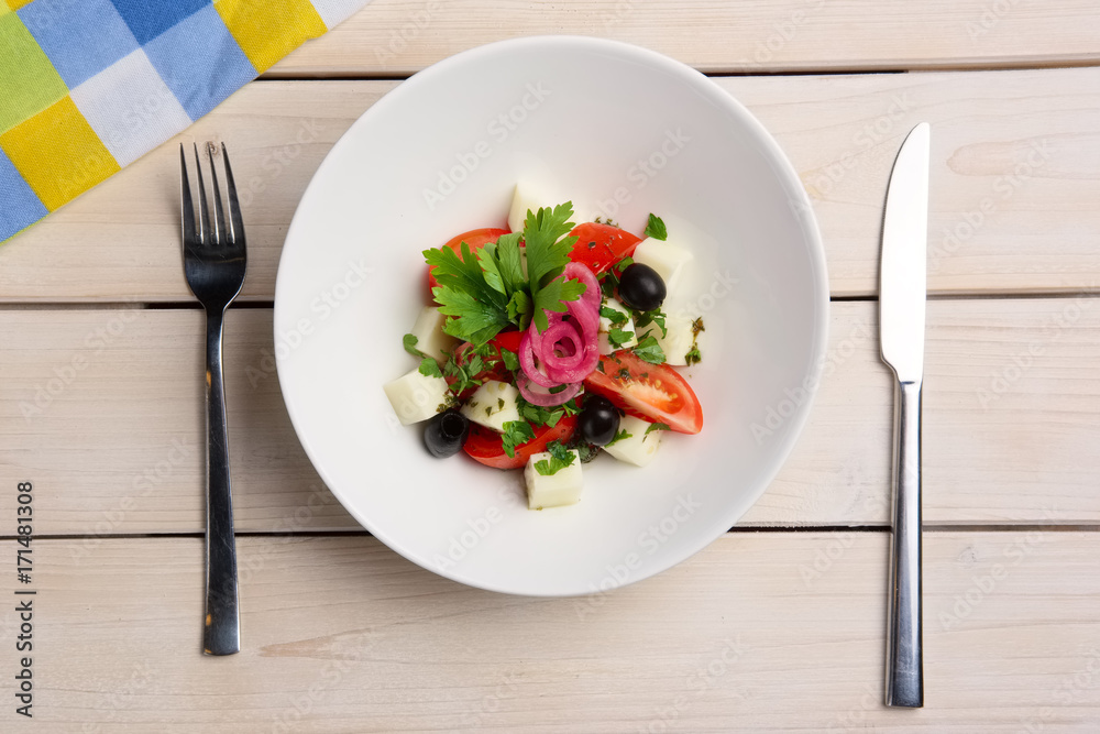 Salad with mozzarella, tomato and olives. Top view. Salad with mozzarella, tomato and olives. Top view.