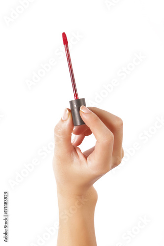 Hand with lipstick applicator isolated on white  