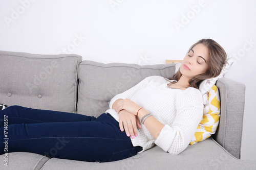 Woman lying on couch. © Mego-studio