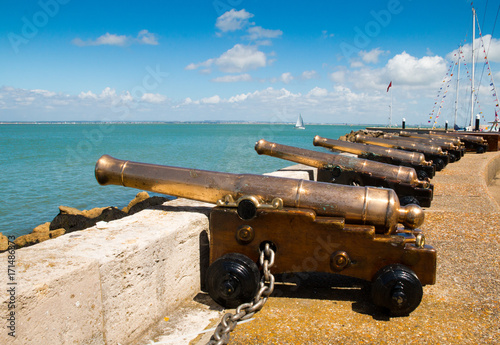The starting cannons lined up looking out over the Solent during Cowes Week 2017 on the Isle of Wight, England photo