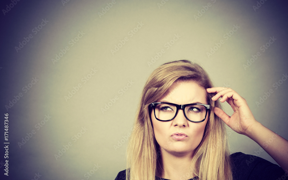 Closeup of woman thinking face expression