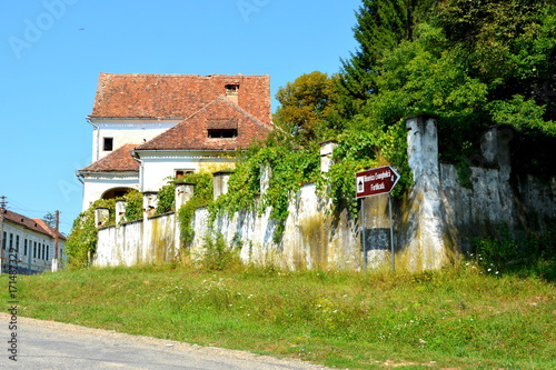 Typical rural landscape and peasant houses in  the village Somartin, Martinsberg, Märtelsberg, Transylvania, Romania. The settlement was founded by the Saxon colonists  photo