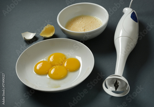 blender and eggs on the table - closeup photo