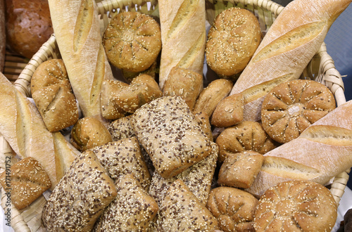 pieces of fresh bread in the bakery with fragrant loaves and bag