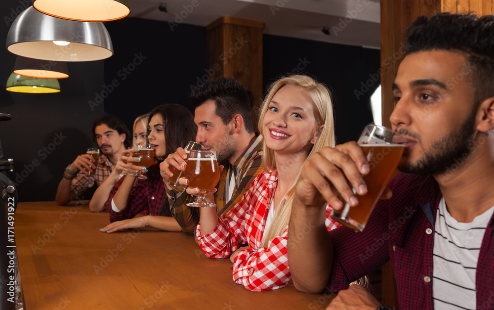 Young People Group In Bar, Barman Friends Sitting At Wooden Counter Pub, Drink Beer Communication Party Celebration