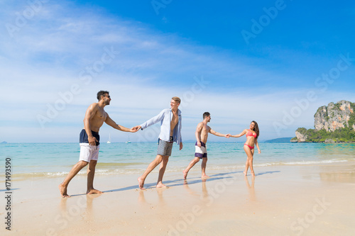 Two Couple On Beach Summer Vacation, Young People In Love Walking, Man Woman Holding Hands Sea Ocean Holiday Travel © mast3r