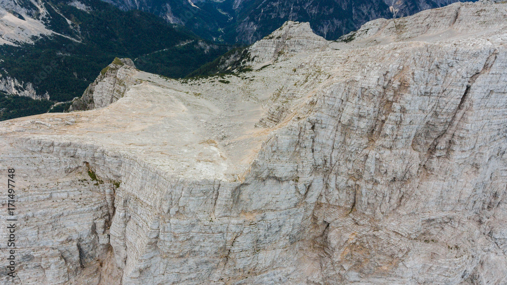 Sheer mountain ridge with visible tectonic layers. Sheer mountain ridge with visible tectonic layers.