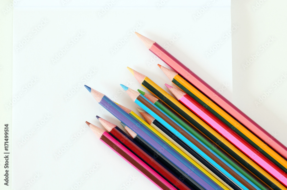 back to school: school supplies, isolated pencils, pens and notepad 