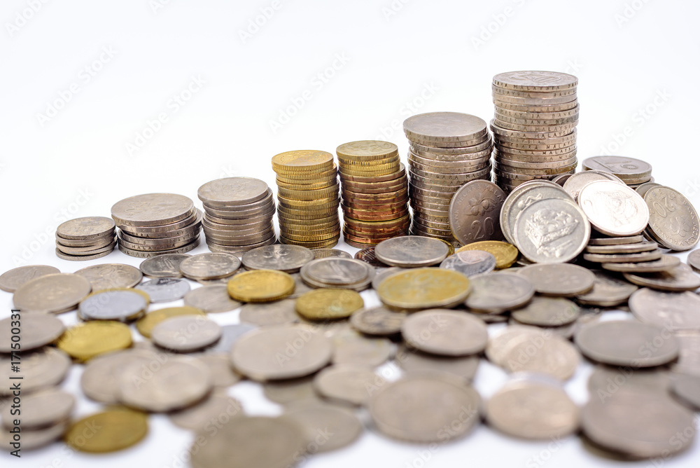 coins stacked in a white background coins stacked in a white background