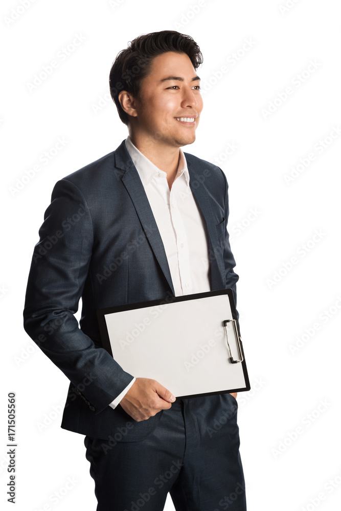 Handsome smiling businessman in a blue suit and white shirt, holding a clipboard with a blank paper. Standing in front of a white background. Handsome smiling businessman in a blue suit and white shirt, holding a clipboard with a blank paper. Standing in front of a white background.