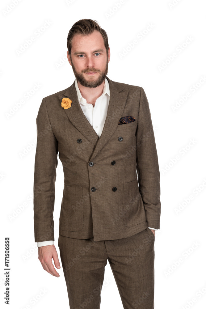 Cool trendy businessman in a brown suit and white shirt standing against a white background with a focused tough look. Cool trendy businessman in a brown suit and white shirt standing against a white background with a focused tough look.