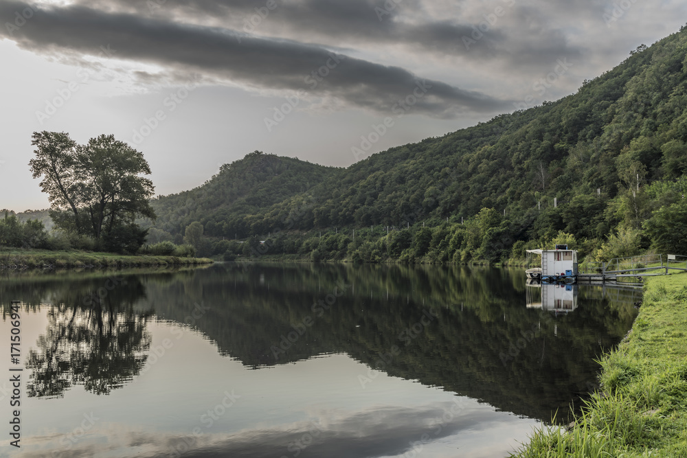 Fototapeta premium River Vltava with cloudy dark sky