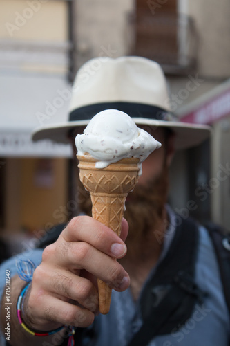 Man covering face with ice-cream