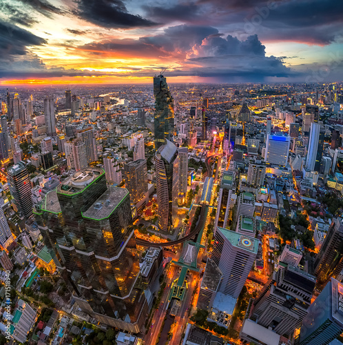 Aerial view of Bangkok buildings, Bangkok city downtown with sunset sky, Transaction beautiful road top view at night traffic