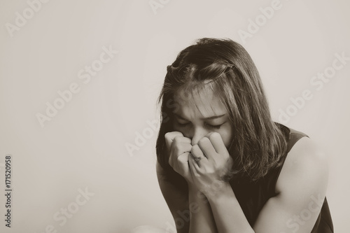 woman feeling sad at window . lonely