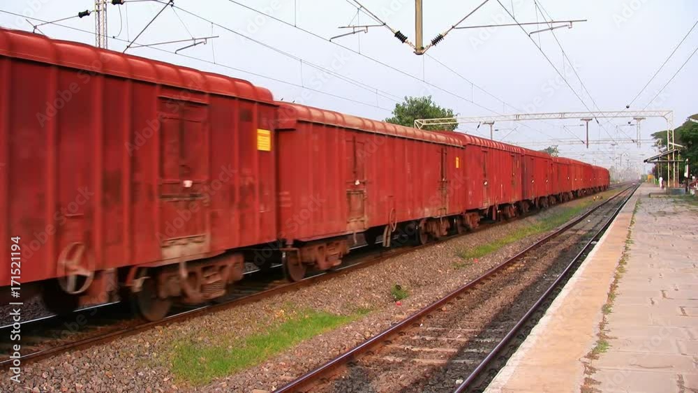 Freight Goods train passes through station in India Freight Goods train passes through station in India