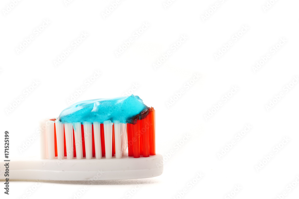Close up of Toothbrush with toothpaste on a white background.