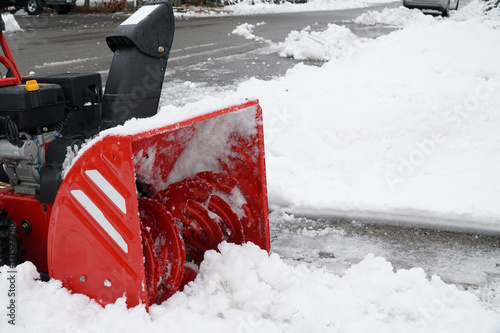 snow blower blowing snow away from driveway © nd700