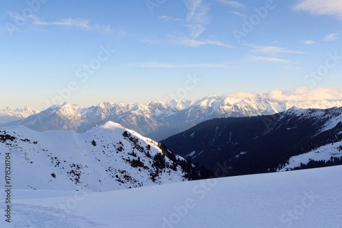Mountain panorama with snow and snowshoe trail in winter in Stubai Alps, Austria