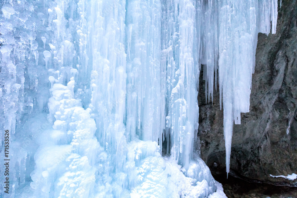 Huge icefall on a rock wall.