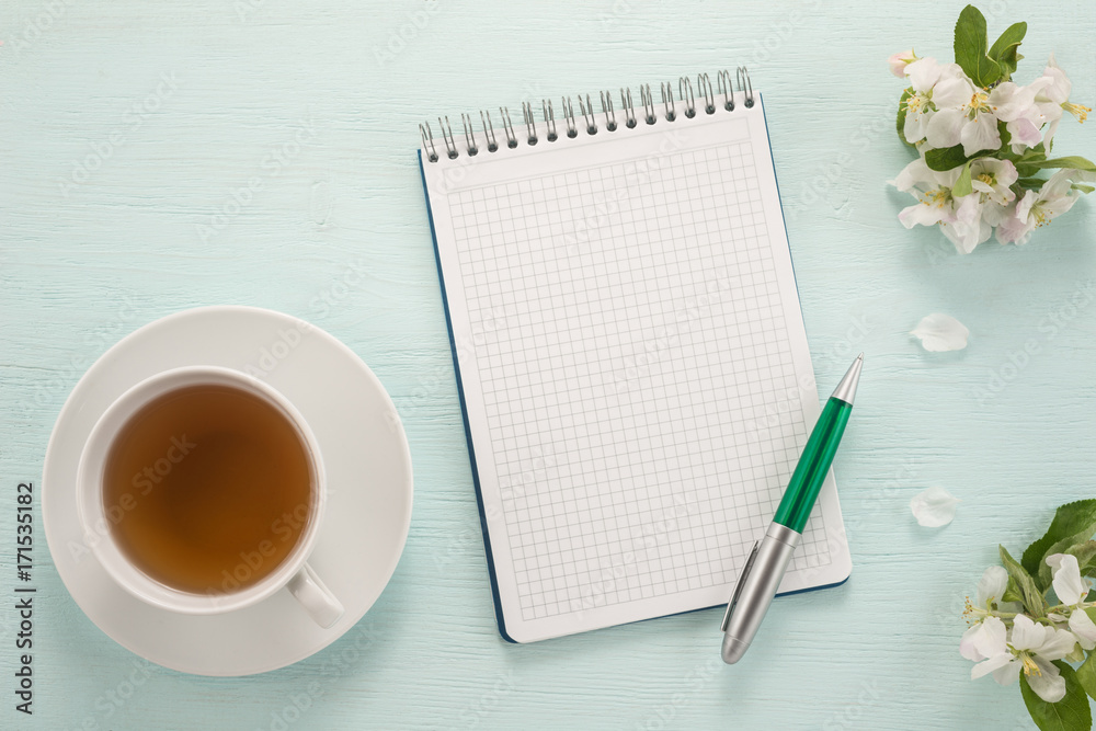 Notepad, pen, flowers and cup of tea Notepad, pen, flowers and cup of tea