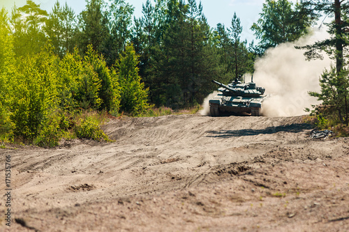 heavy battle tank attacks on the ground in the woods