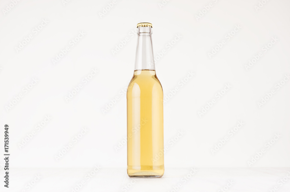 Transparent longneck beer bottle 500ml with lager, mock up. Template for advertising, design, branding identity on white wood table. Transparent longneck beer bottle 500ml with lager, mock up. Template for advertising, design, branding identity on white wood table.