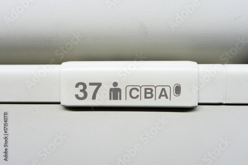 seat numbers on Luggage shells inside the passenger airplane
