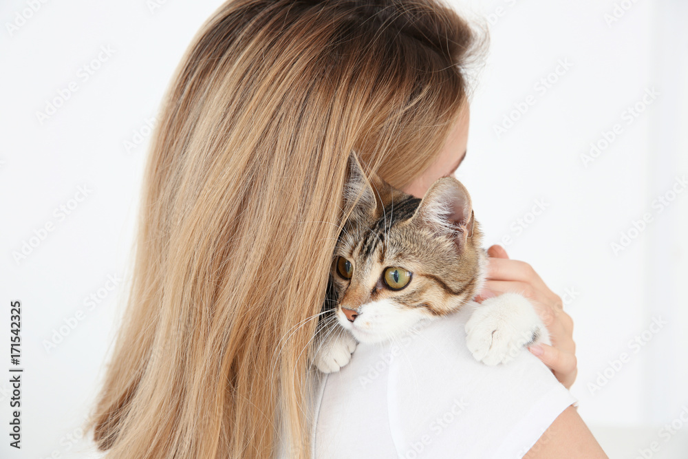 Obraz premium Young beautiful woman with cat, isolated on white