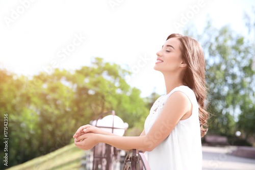 Beautiful young woman outdo...