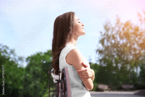 Beautiful young woman outdo...