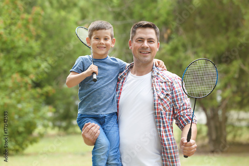 Happy father and son with t...