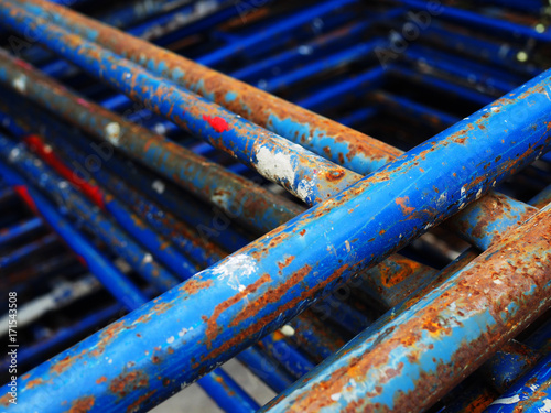 Obraz na plátně Old rusty dirty damaged peeled off blue painted iron steel construction rod stic