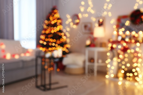 Room decorated for Christmas and beautiful fir tree  blurred view