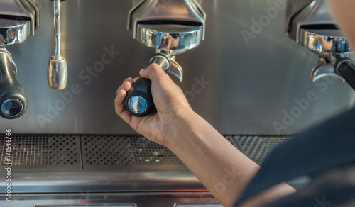 coffee machine preparing fresh coffee and pouring into cups  Service Concept © Thammasiri