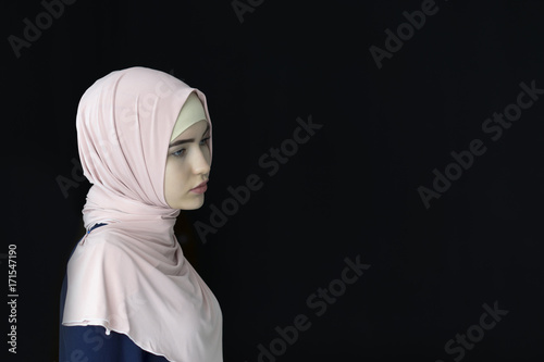 Portrait of a beautiful Muslim woman wearing hijab, isolated