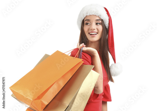 Young woman in Santa hat ho...