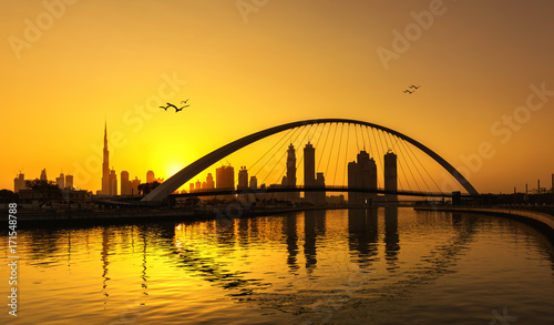 Fototapeta Naklejka Na Ścianę i Meble -  Dubai skyline thru Canal bridge