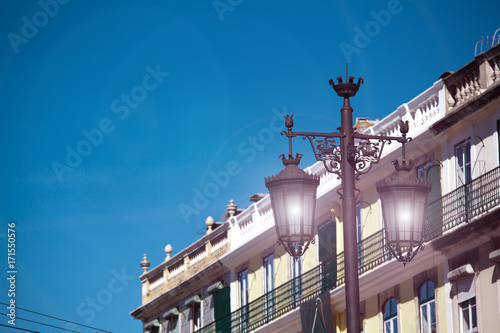 Old street lamp on a classical facade in Lisbon © Kalnenko