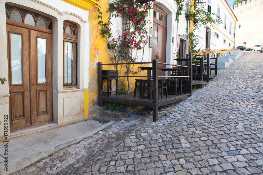 Narrow street in the medieval Portuguese City of Obidos Narrow street in the medieval Portuguese City of Obidos