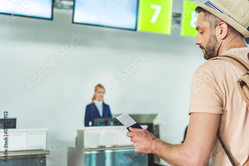 man with passport and ticket