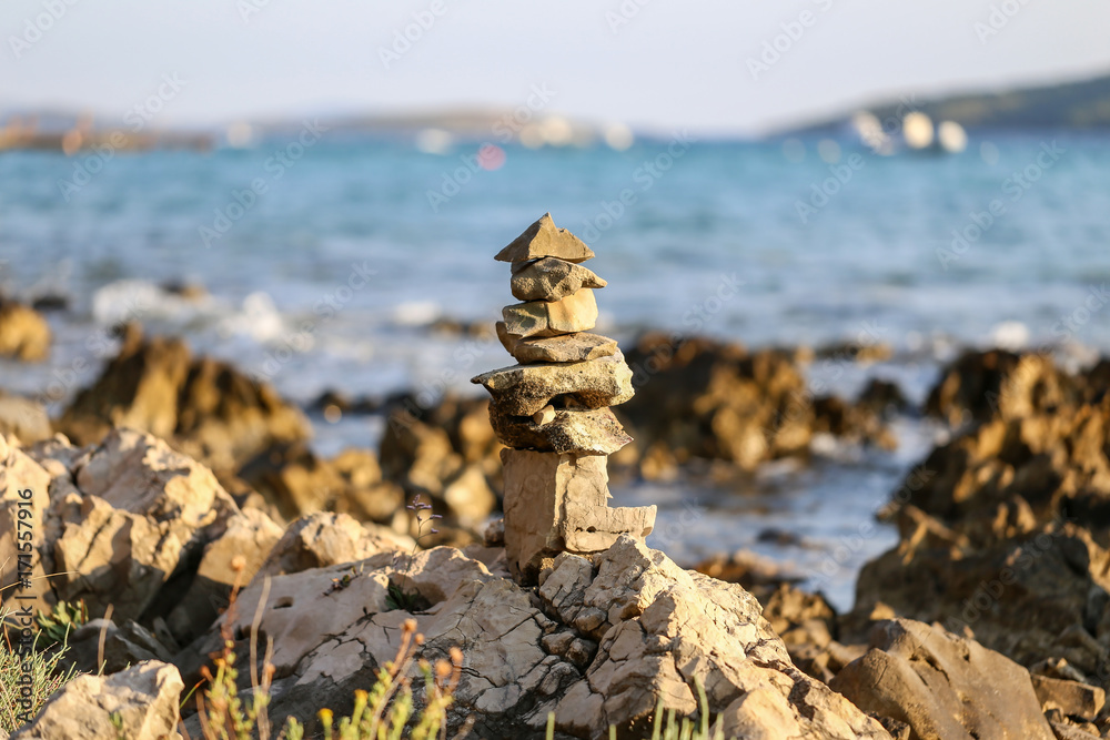 Column laid out of stones near the sea Column laid out of stones near the sea