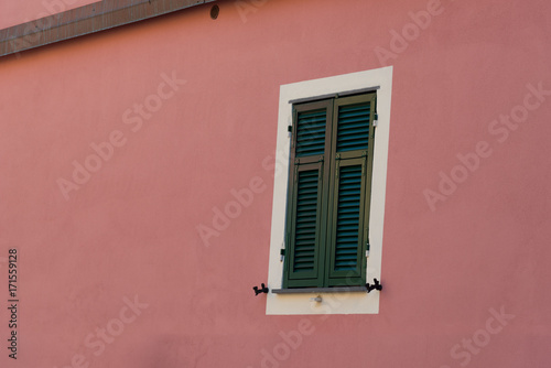 Traditional window of Italian house in a village of Manarola - Cinque Terre National Park. The Cinque Terre area is a very popular tourist destination and a world heritage site.