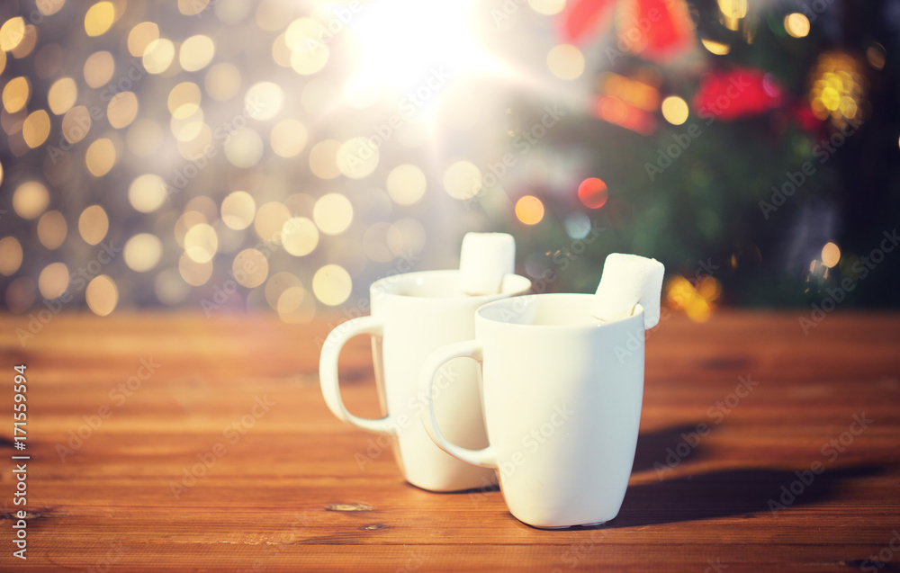 cups of hot chocolate with marshmallow on wood cups of hot chocolate with marshmallow on wood