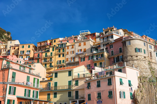 Fototapeta Naklejka Na Ścianę i Meble -  Magnificent daily view of the Manarola village in a sunny summer day. Manarola is one of the five famous villages in Cinque Terre (Five lands) National Park. Liguria, Italy, Europe