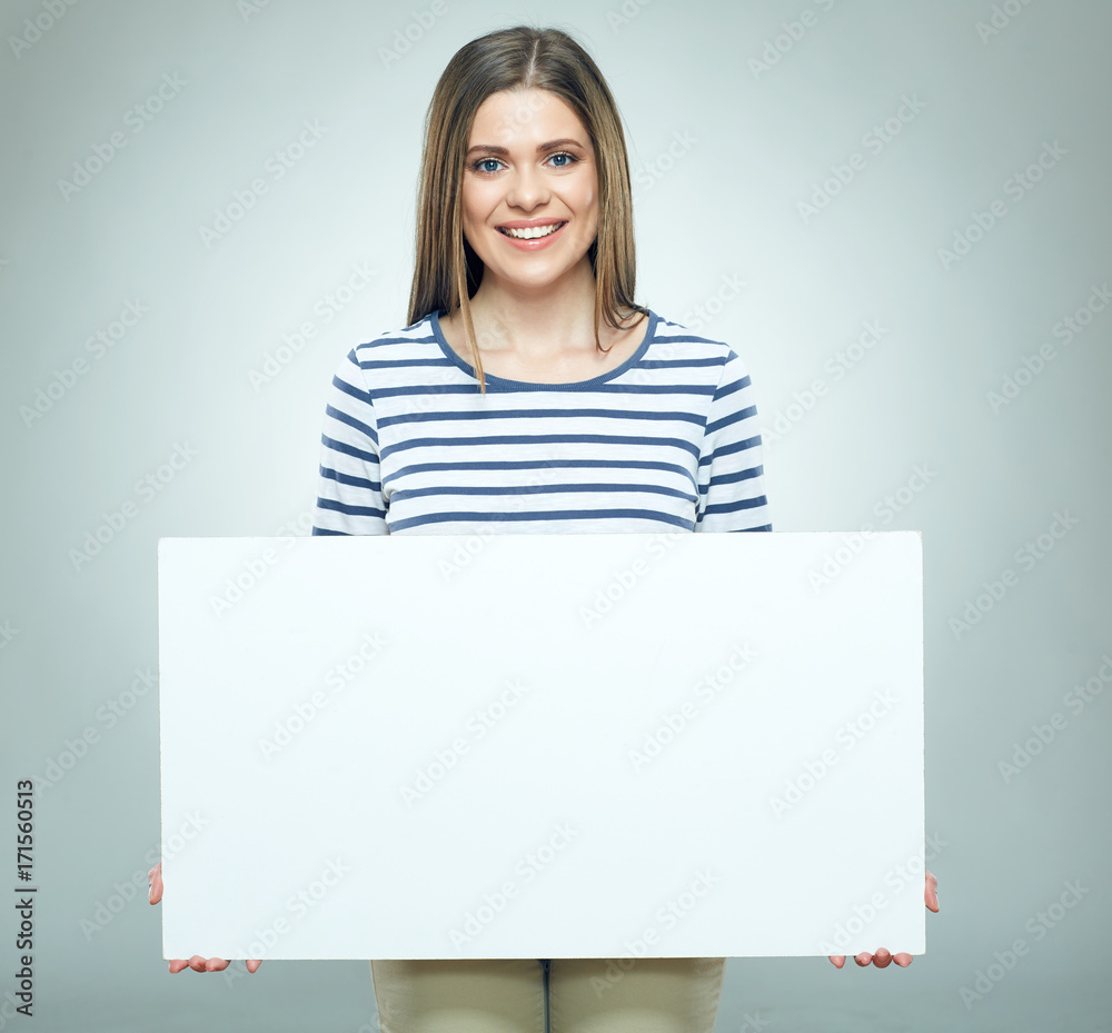 Smiling woman holding white banner wearin striped. Smiling woman holding white banner wearin striped.