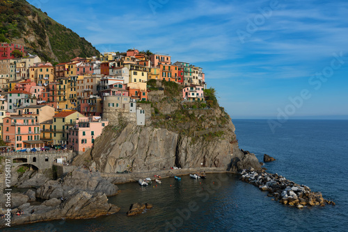 Magnificent daily view of the Manarola village in a sunny summer day. Manarola is one of the five famous villages in Cinque Terre  Five lands  National Park. Liguria  Italy  Europe