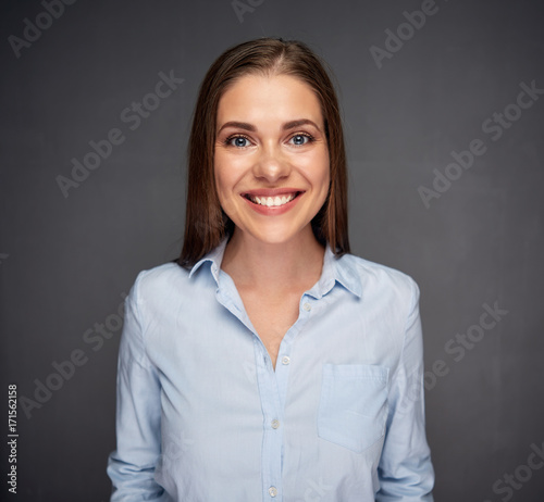Young business woman smiling with teeth.