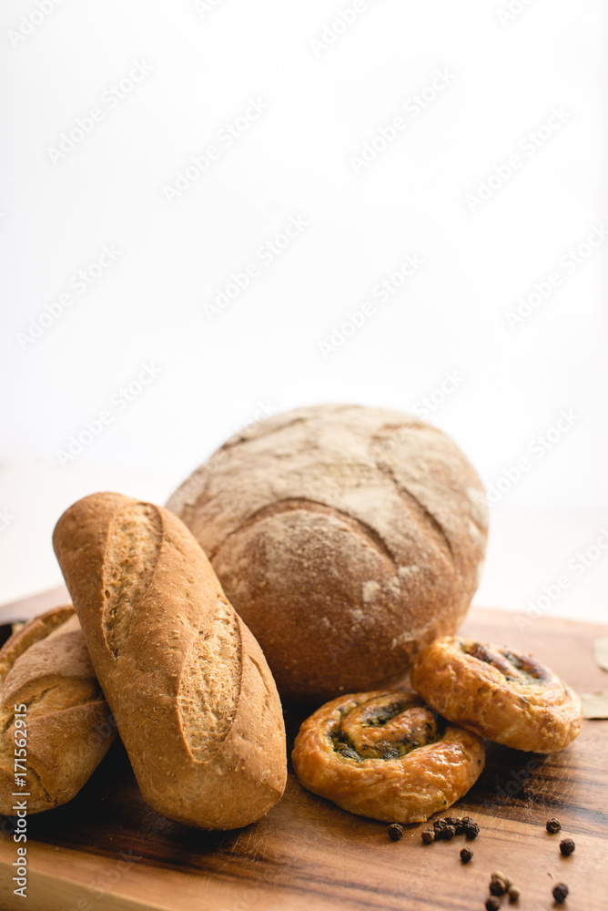 Fresh bread on the wooden cutting board